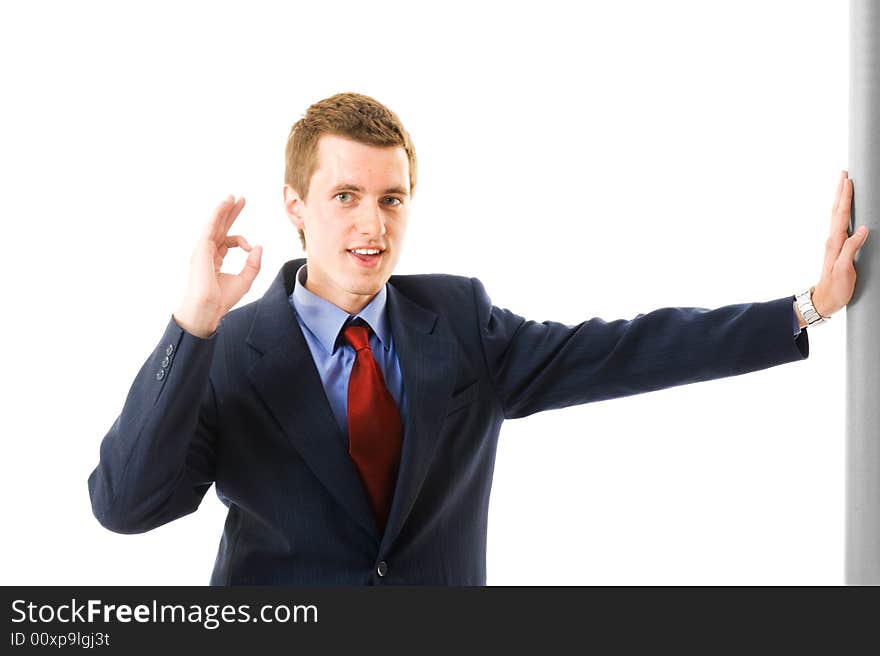 Young businessman showing thumb up