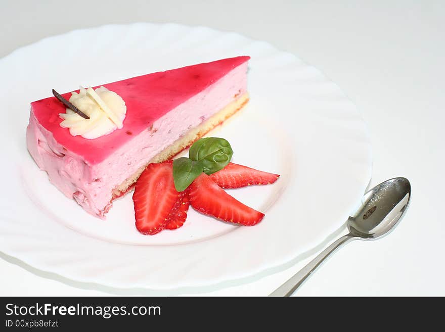 Slice of  cake with strawberry, selective focus, flash. Slice of  cake with strawberry, selective focus, flash