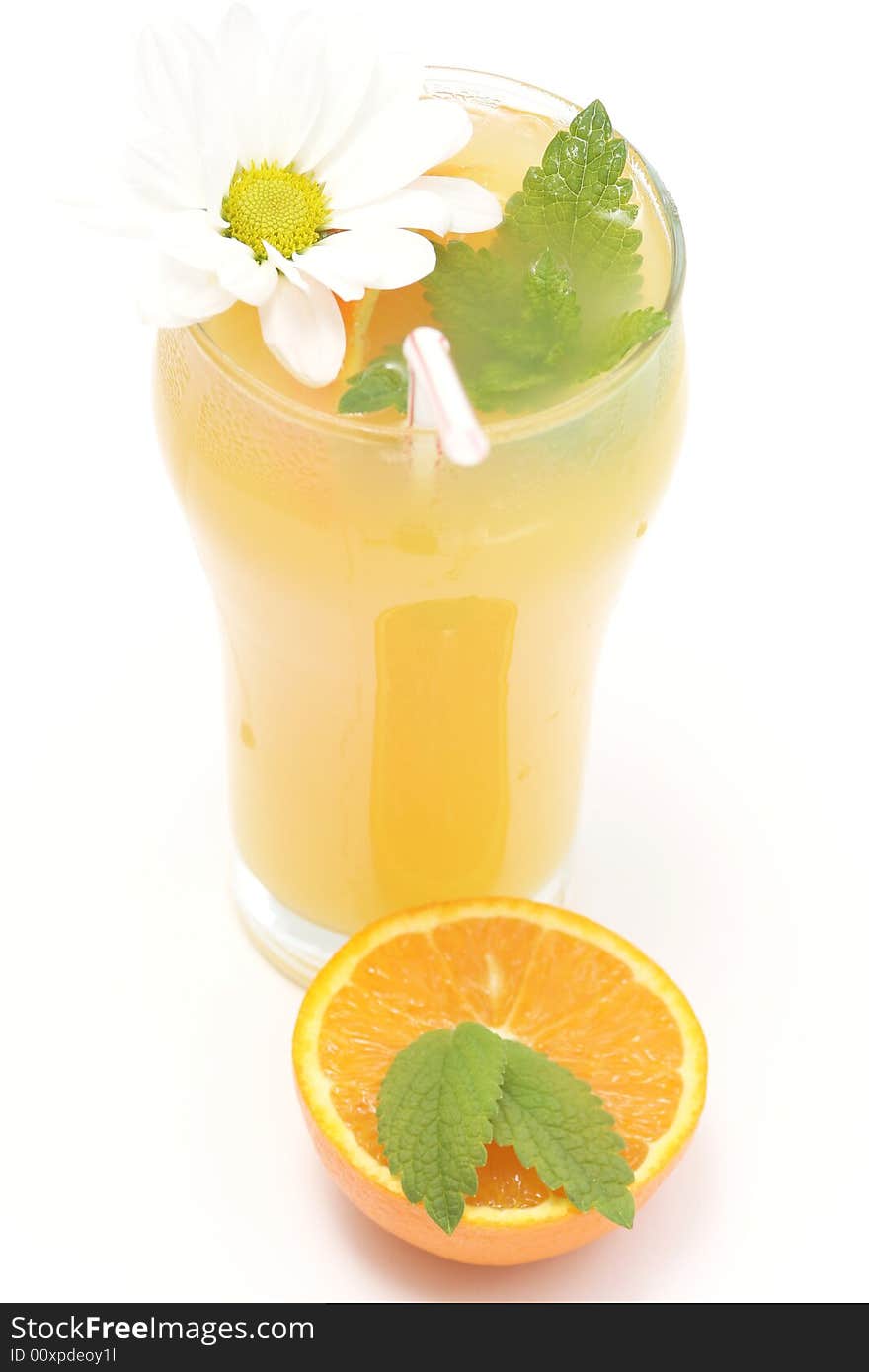 Glass of orange juice,flower and fresh mint against white background. Glass of orange juice,flower and fresh mint against white background