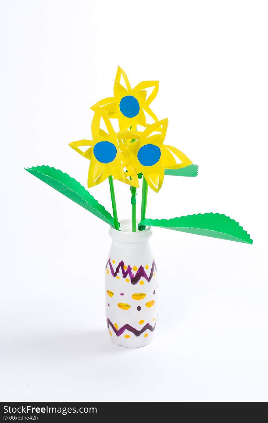 Three yellow paper flowers in vase, manual work. Three yellow paper flowers in vase, manual work