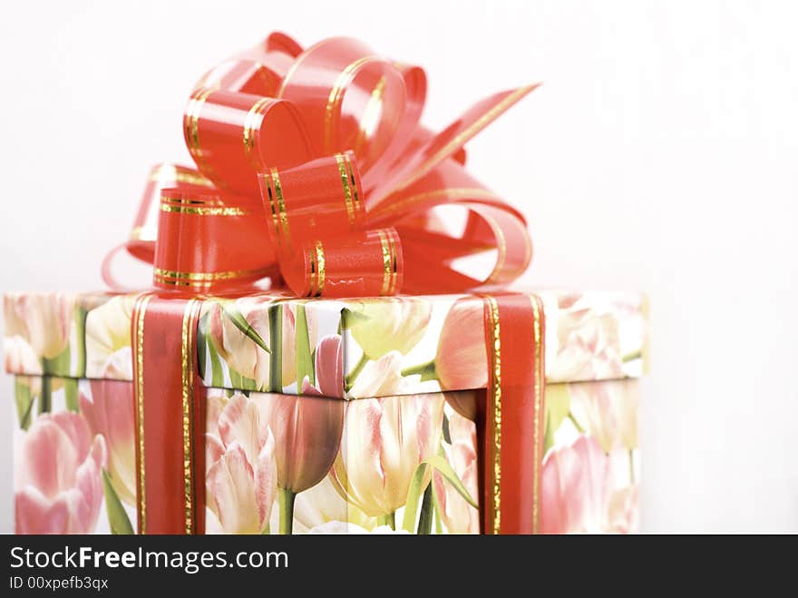 Gift box with red bow at white background. Gift box with red bow at white background