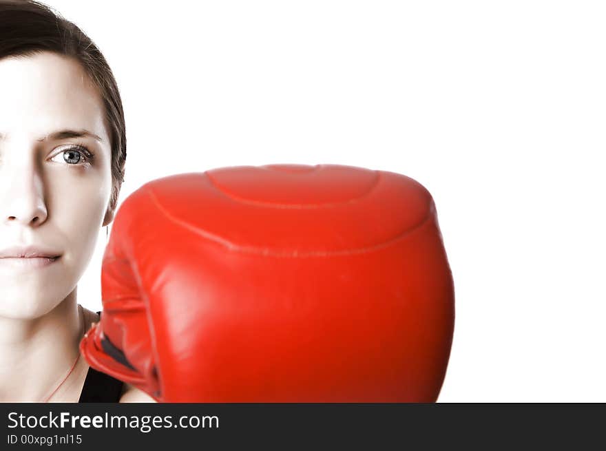 Woman in gym clothes, with boxing gloves, strength