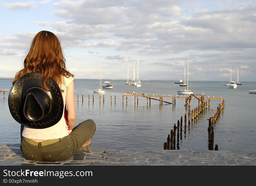 Back of girl looking for sea travel. Back of girl looking for sea travel