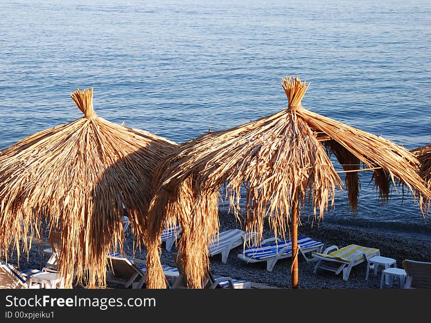 Two sunshadies on the beach