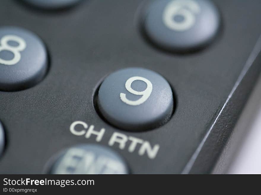 A close up of a number nine button on a remote control