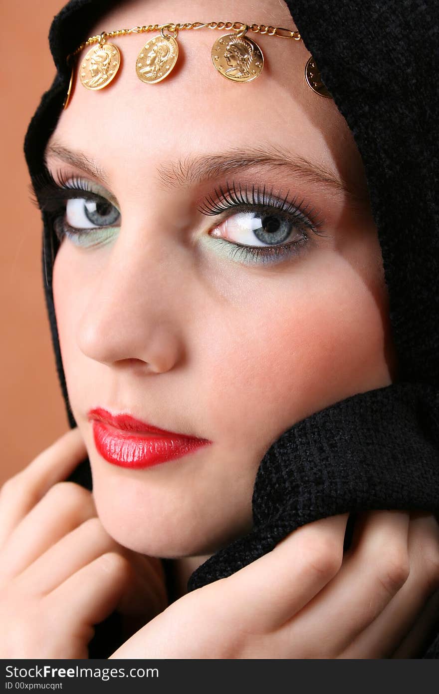 Female model with blue eyes wearing traditional folk dress