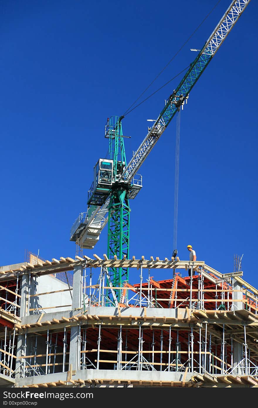 Construction crane against clear blue sky