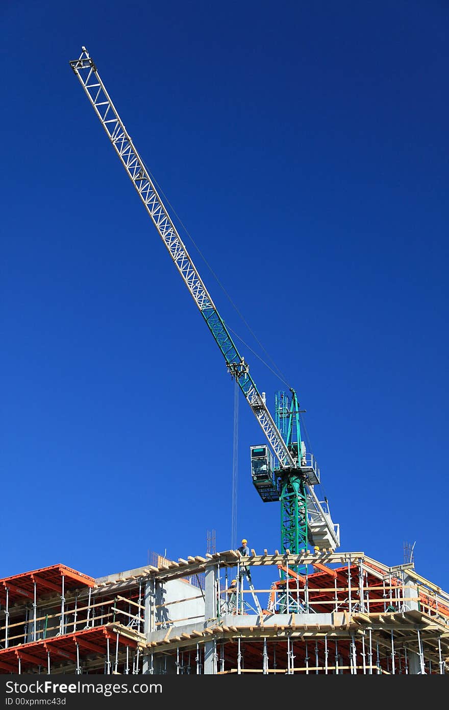 Construction crane against clear blue sky