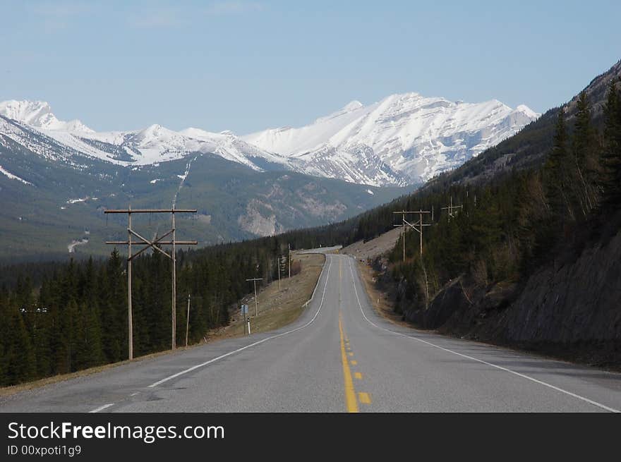Landscape of spring rocky mountain and highway in kananaskis county, alberta, canada