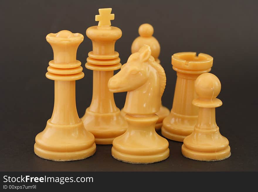 Set of white chess figures on dark background. Set of white chess figures on dark background