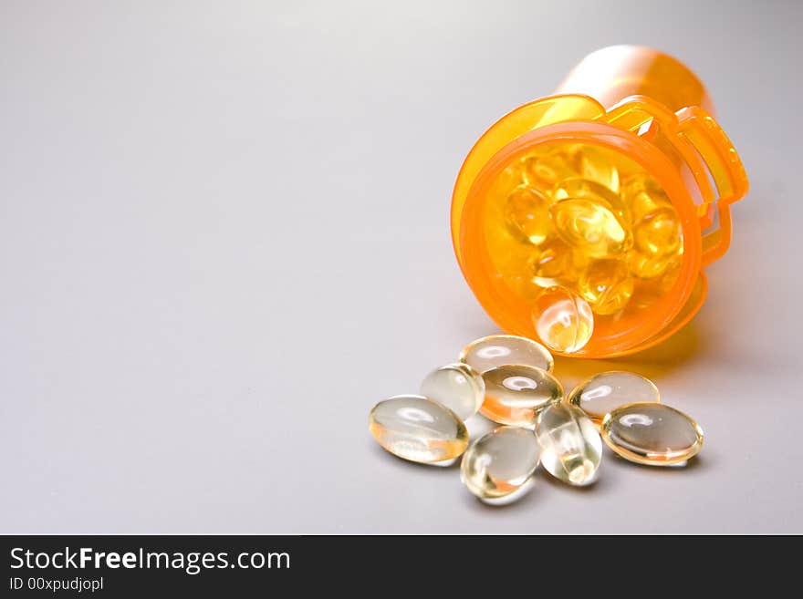 Medication tablet in the orange bottle. Medication tablet in the orange bottle.