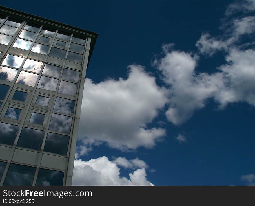 Office building with glass walls on a sunny day. Office building with glass walls on a sunny day