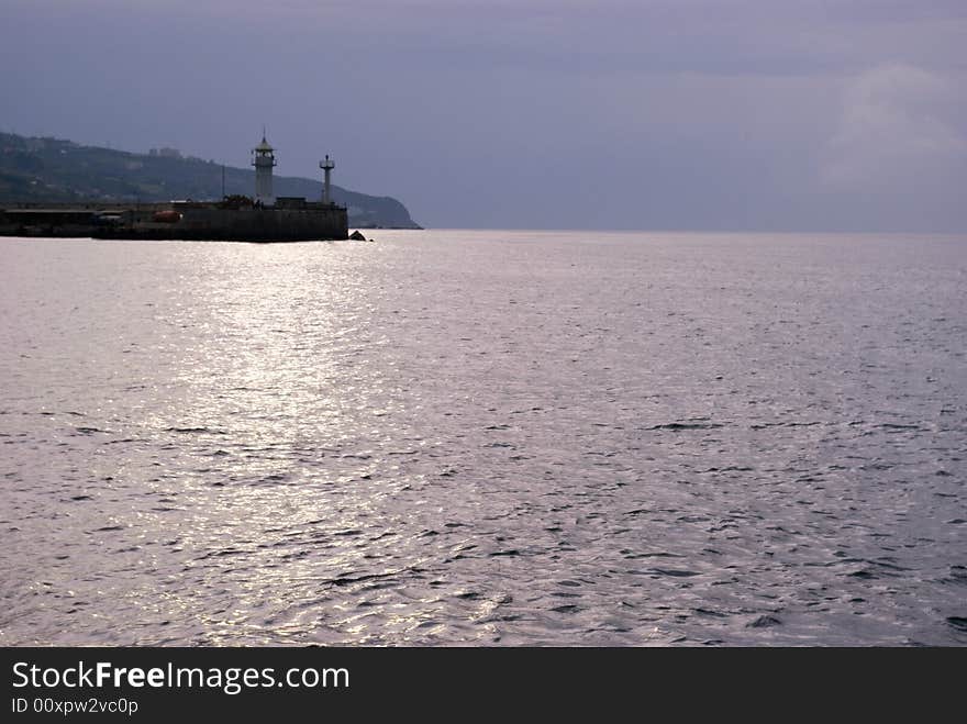 Cloudy sunrise above seamark, Yalta