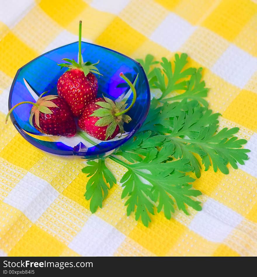 Three Strawberries Lying On Plate