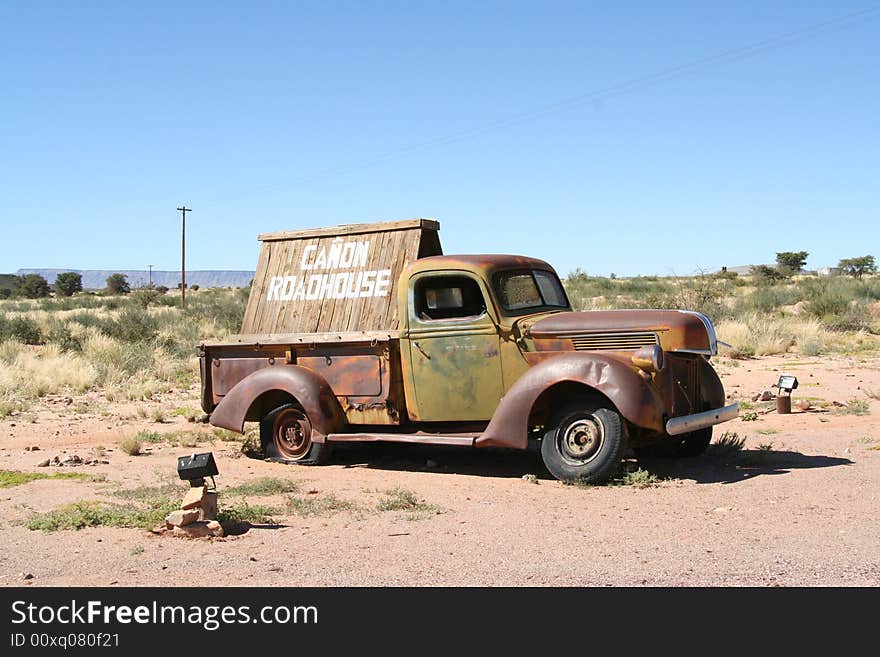 Old vehicle used as a sign post in the middle of no-where. Old vehicle used as a sign post in the middle of no-where