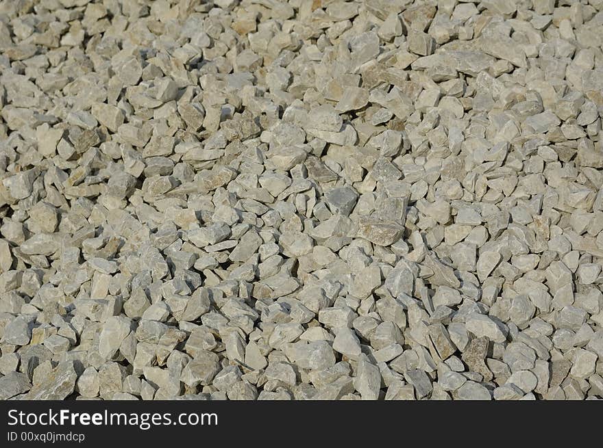 Crushed stone background. Gray granite. Crushed stone background. Gray granite