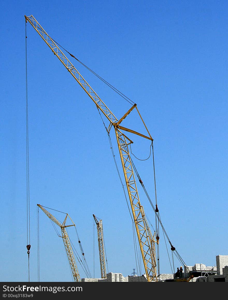 Building crane and the blue sky