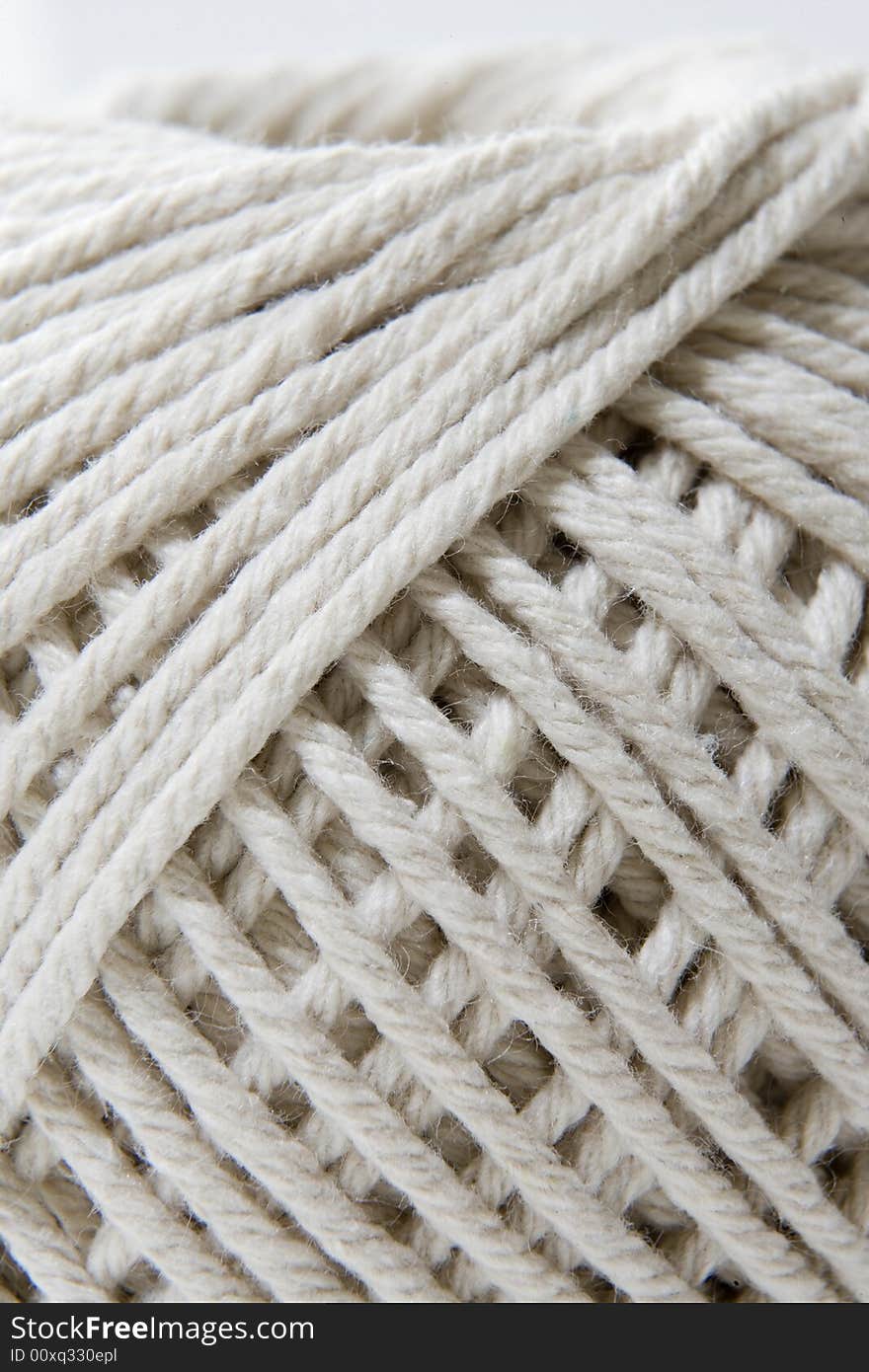 Close-up section of a ball of string showing the texture and fiber of thread