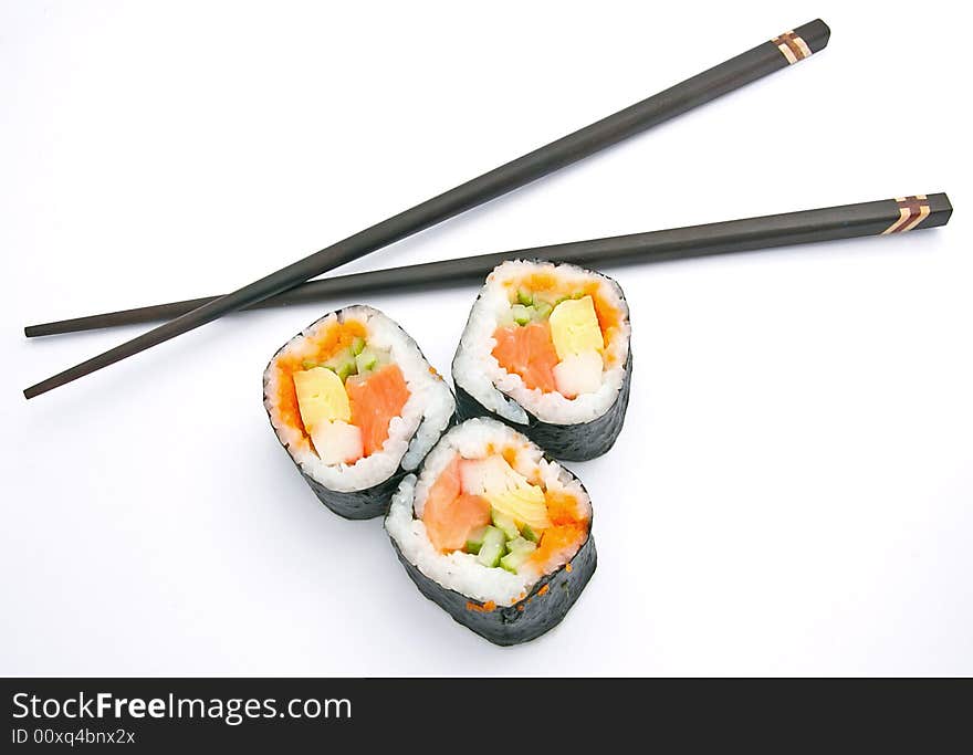 Sushi and chopsticks on white. Sushi and chopsticks on white