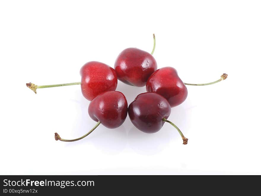 Five cherries isolated on a white background. Five cherries isolated on a white background.