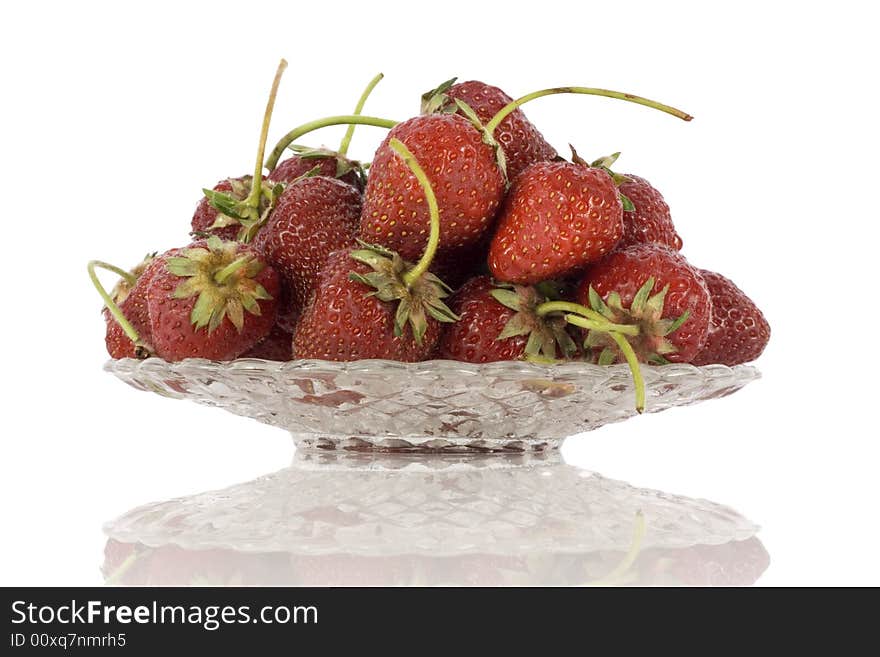 Strawberries on plate isolated on white background