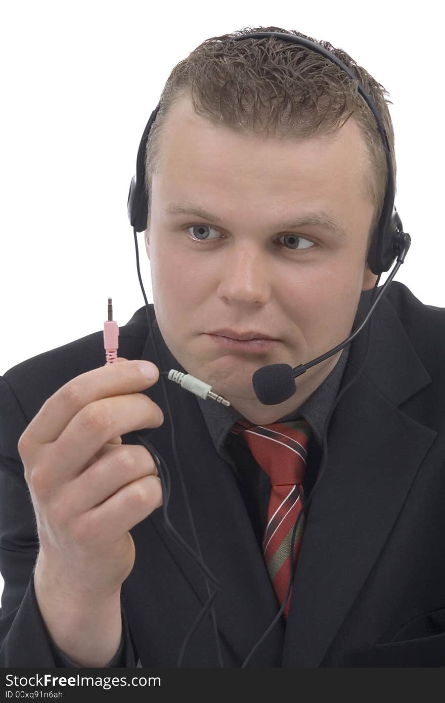 Man telephonist with hands-free phone against a white background. Man telephonist with hands-free phone against a white background