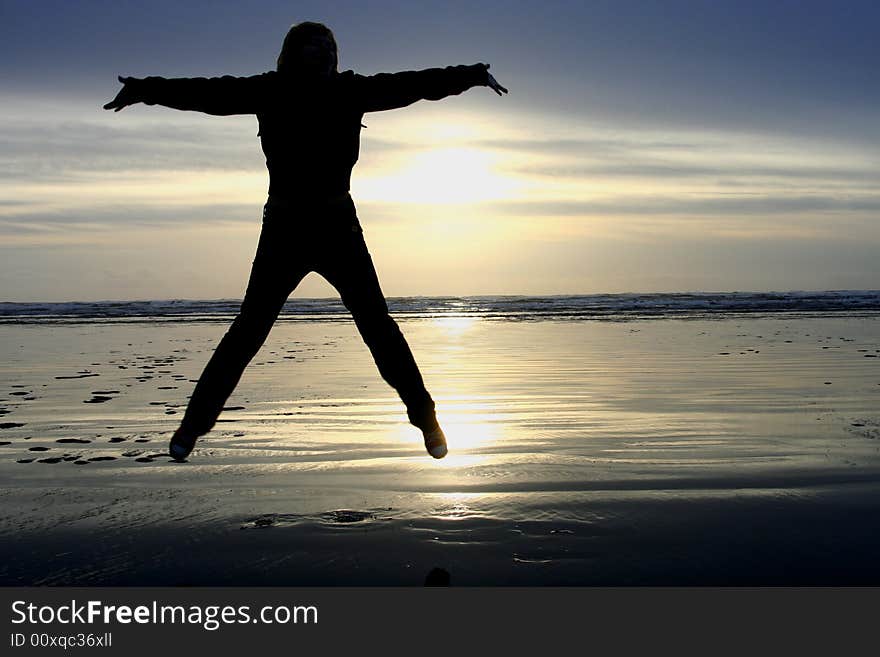 Jump in the beach during sunset