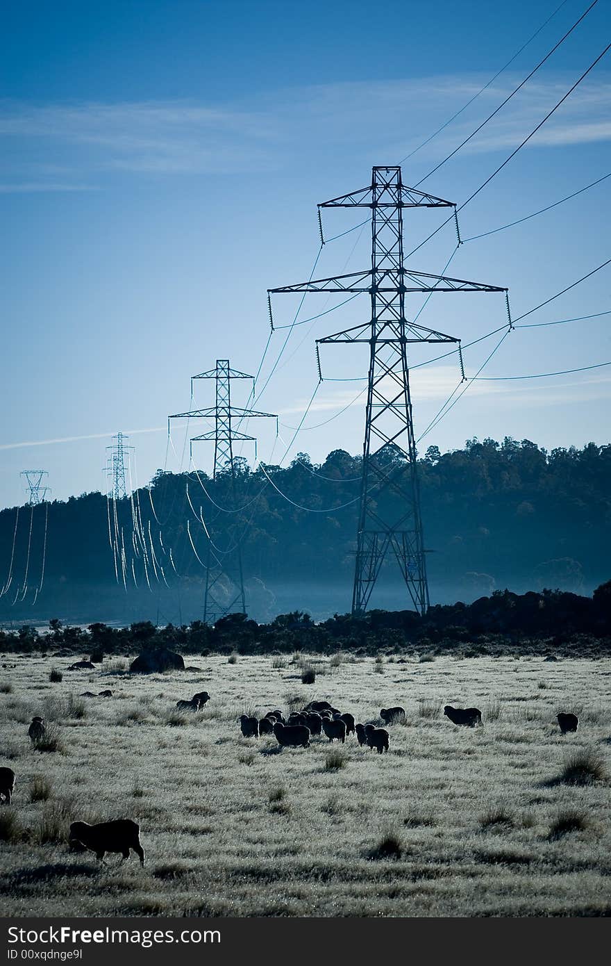 Abstract Power pylons crossing farmland