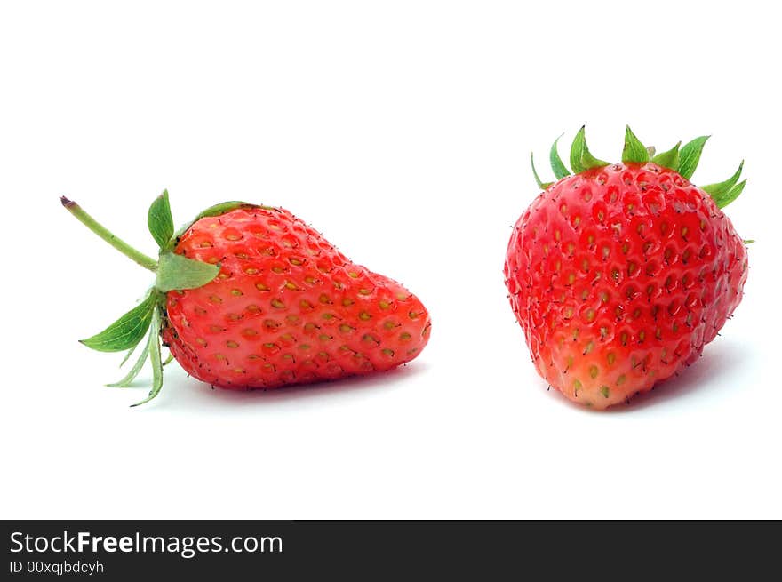 The juicy fresh just washed strawberry on a white background. The juicy fresh just washed strawberry on a white background