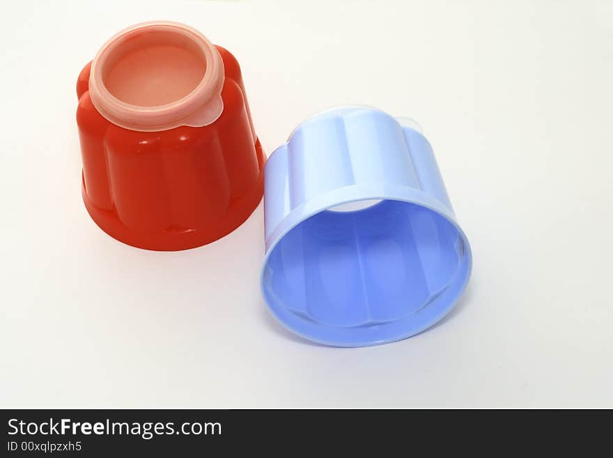 Blue and red jelly moulds for single servings of food