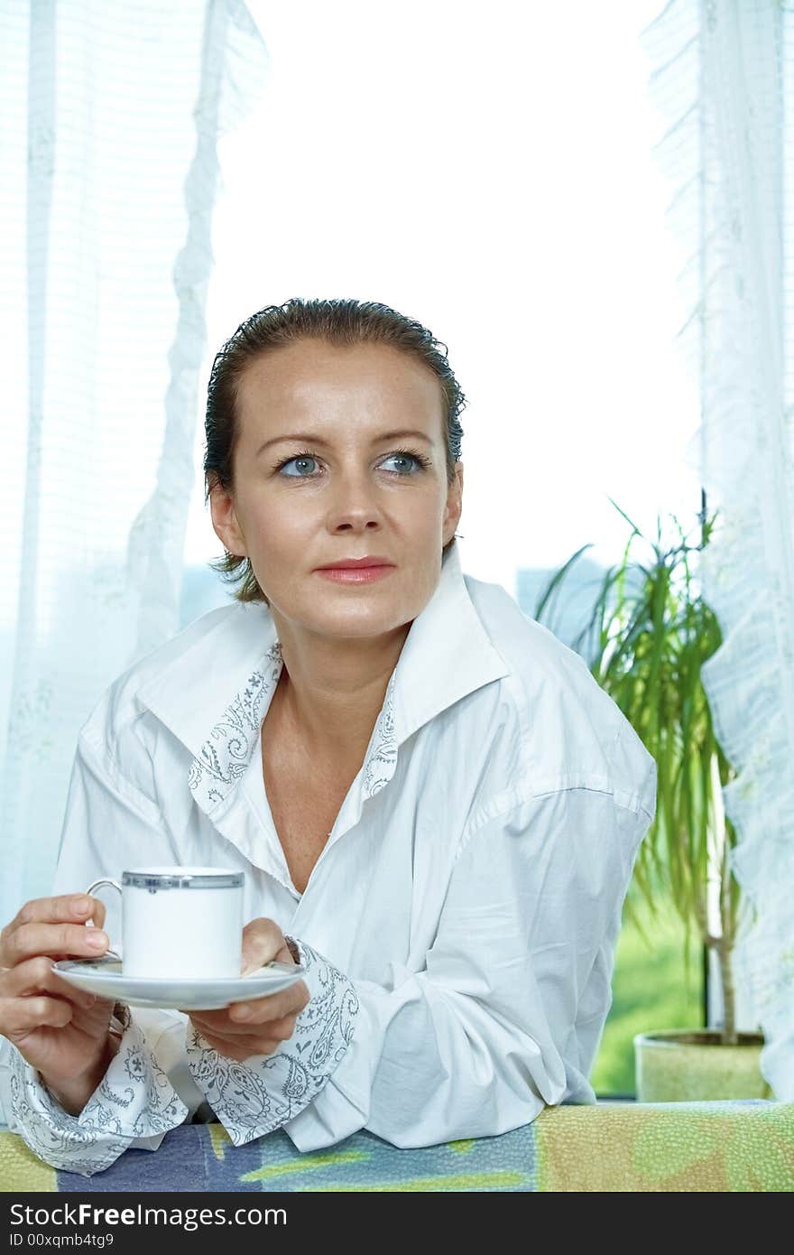 High key portrait of nice gorgeous woman drinking coffee