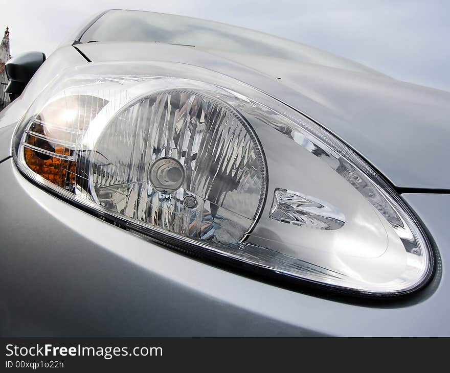 Close up view of a car's headlight.