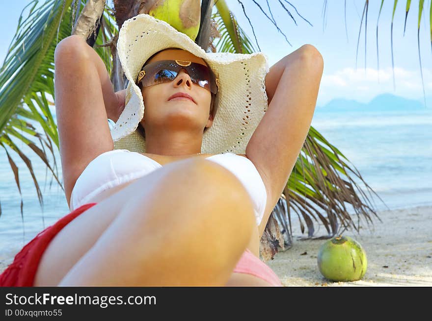 View of nice woman having fun on tropical beach. View of nice woman having fun on tropical beach