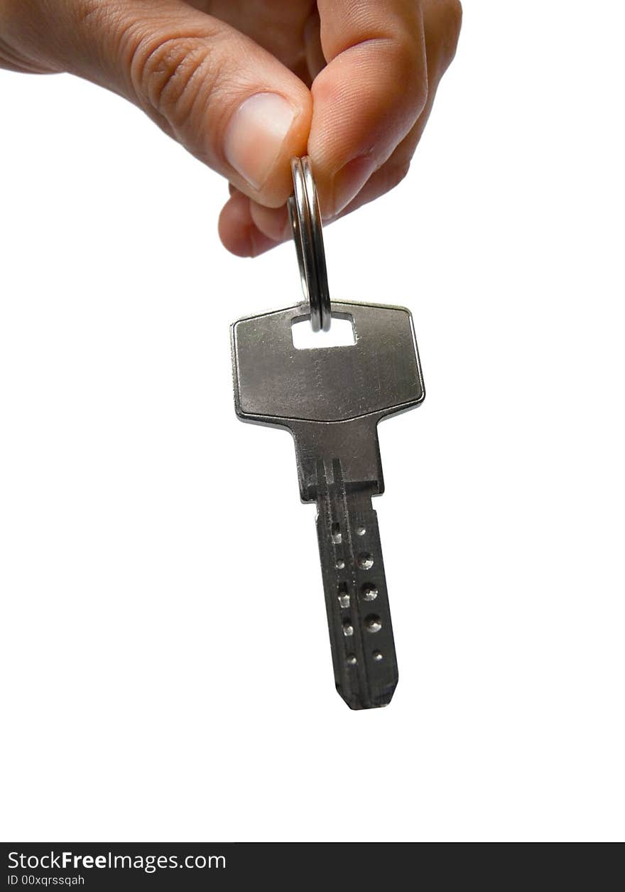 Key in hand. Object over white.