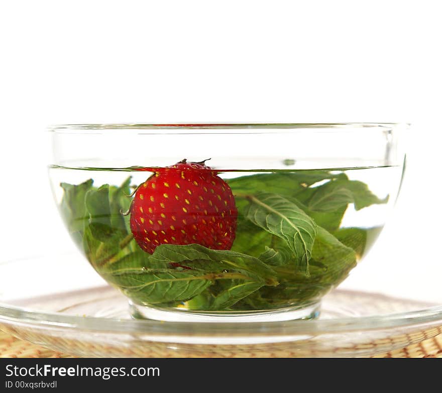 Herbal tea with mint and a strawberry. Herbal tea with mint and a strawberry