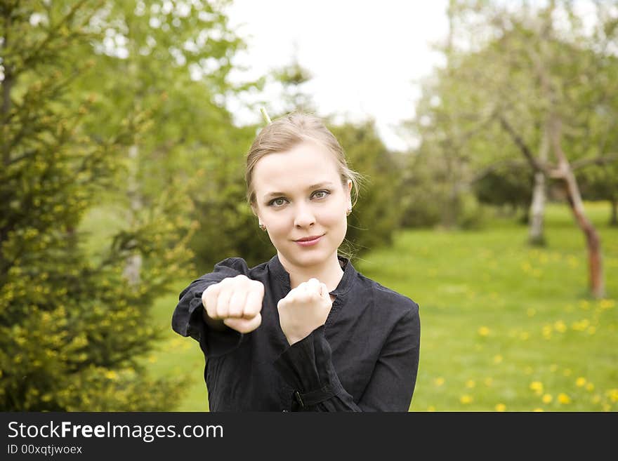 Young Woman Training In The Garden. Young Woman Training In The Garden