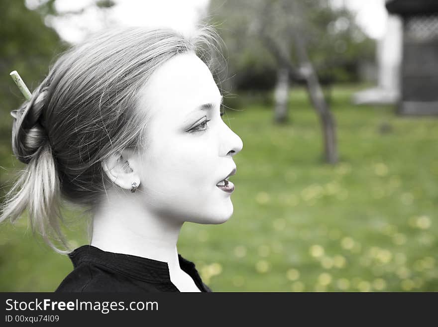 Young Woman In The Garden. Young Woman In The Garden