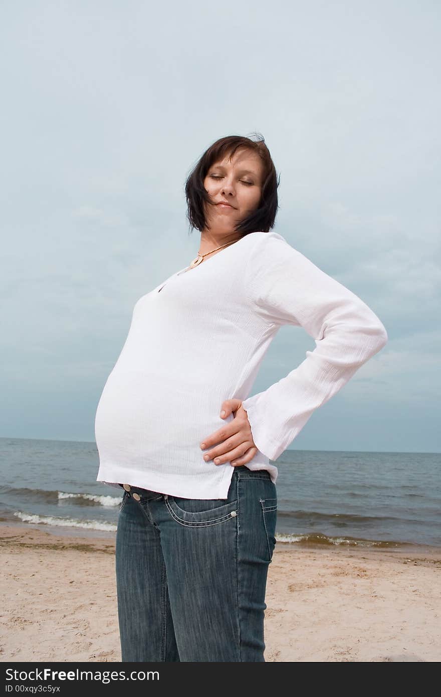 Pregnant woman on the beach. Pregnant woman on the beach