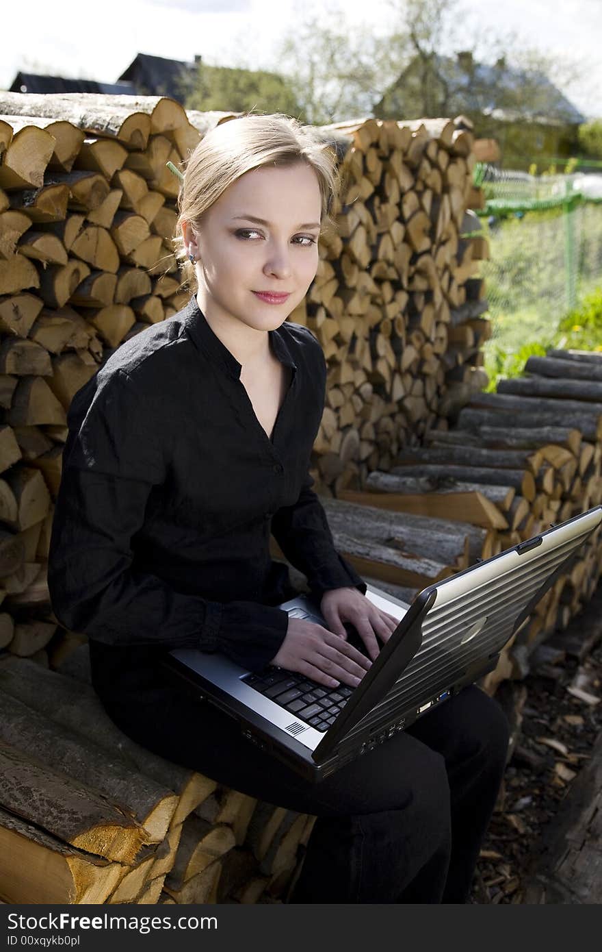 Student Woman With Laptop In The Willage. Student Woman With Laptop In The Willage