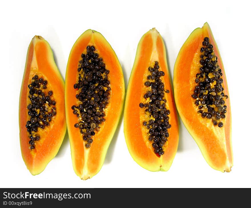 Bunch of papaya fruit slices viewed from the top isolated on a white background. Bunch of papaya fruit slices viewed from the top isolated on a white background.