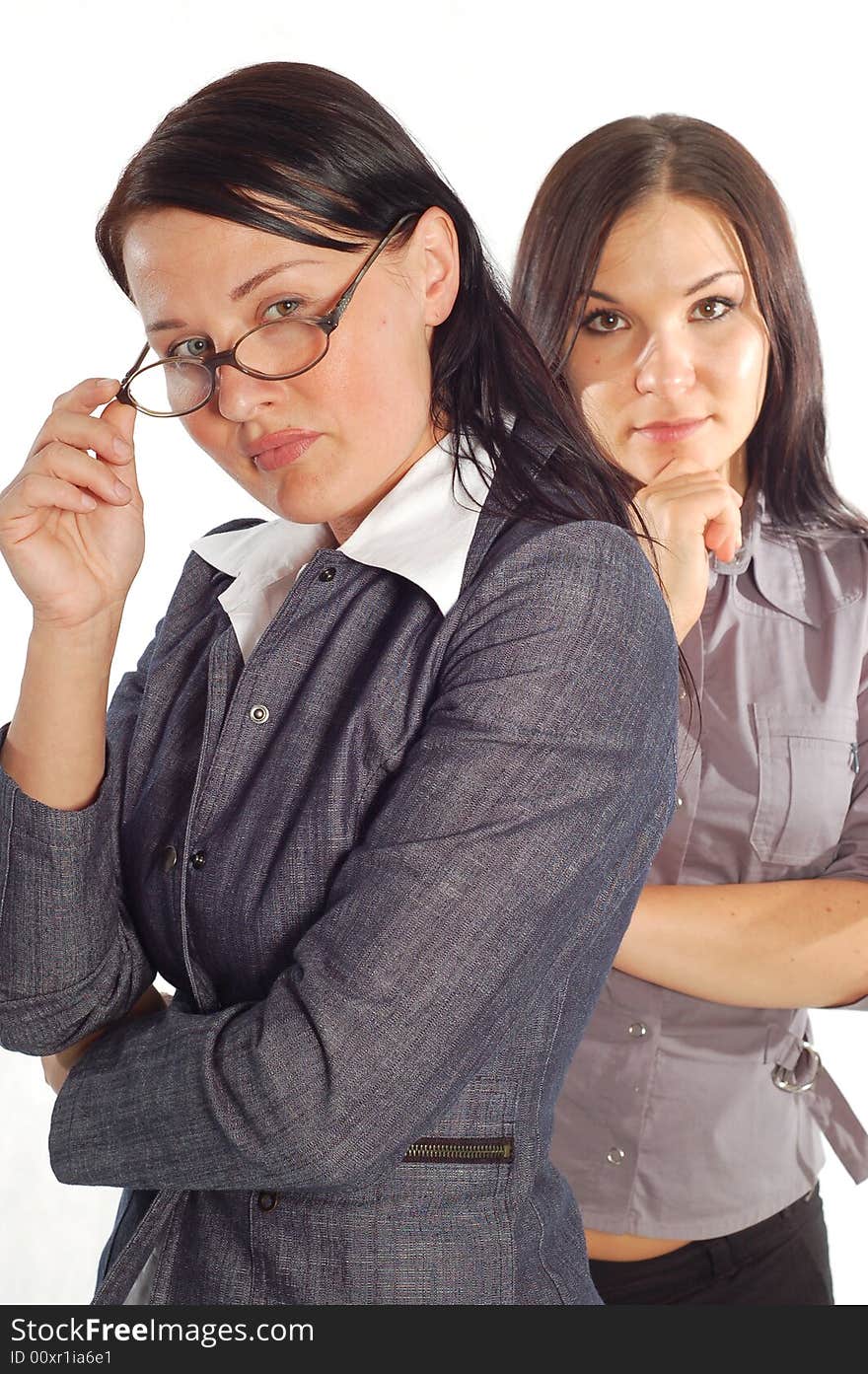 Two attractive business women on white background. Two attractive business women on white background