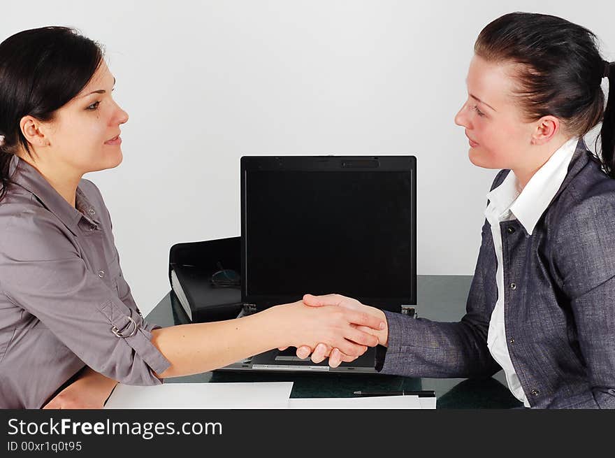 Two attractive business women in office. Two attractive business women in office