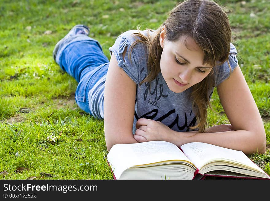 Young Woman Reading A Book