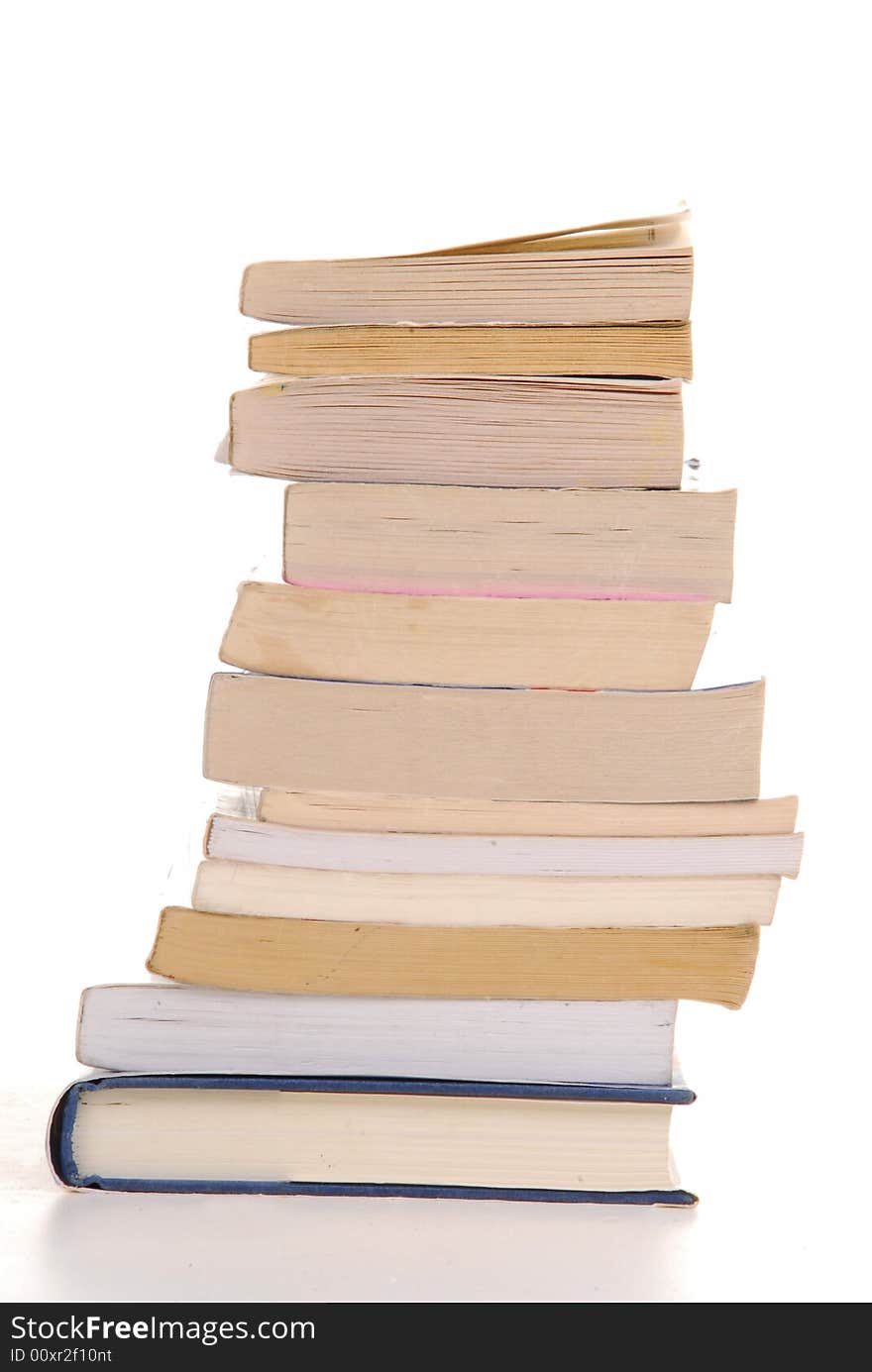 Books on top of eachother isolated by white. Books on top of eachother isolated by white