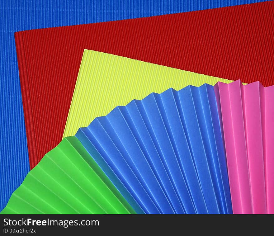 Colorful corrugated and folded paper, close up. Colorful corrugated and folded paper, close up