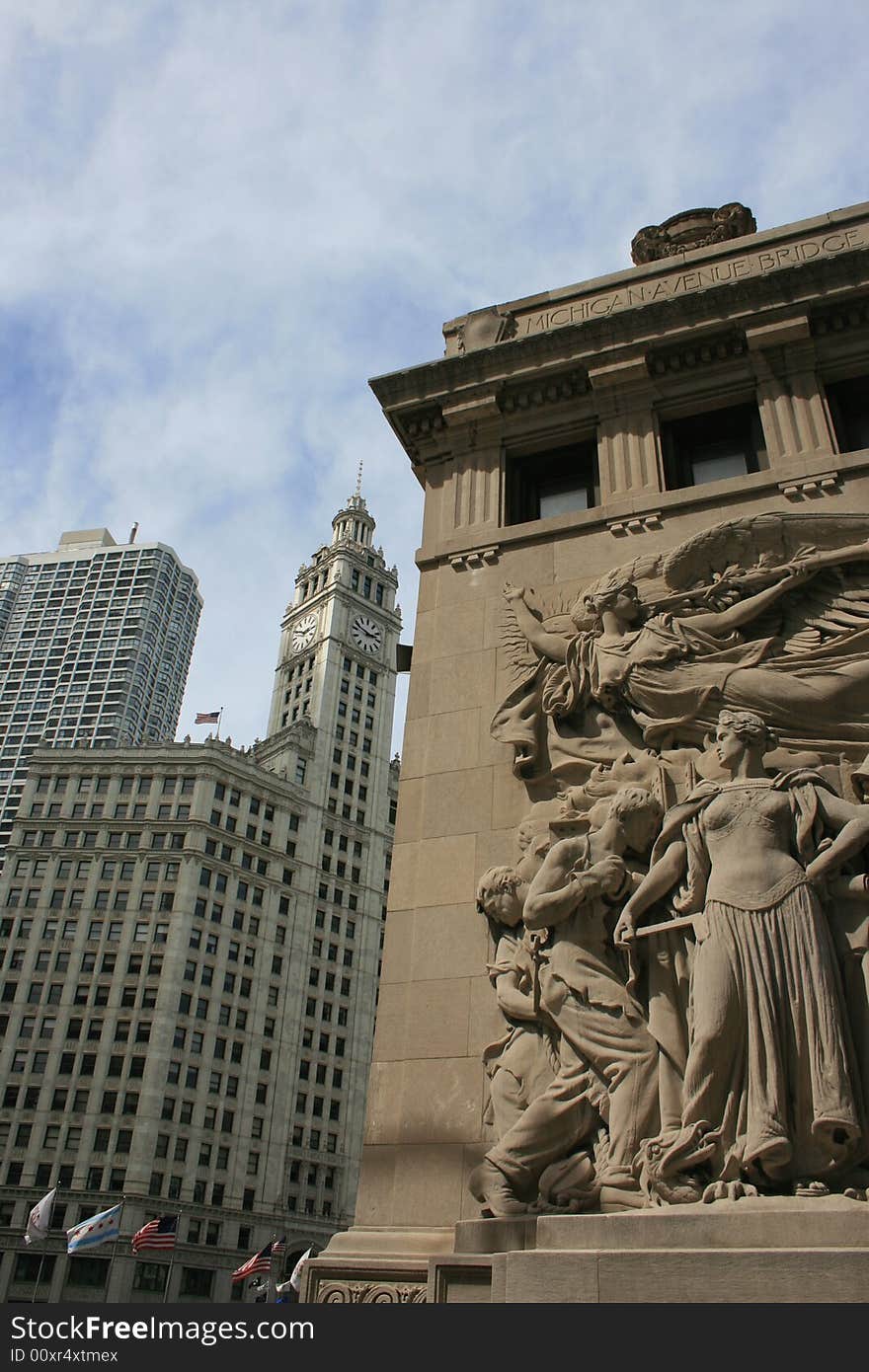 Ornate carvings along the Michigan Avenue Bridge.  Wrigley Building in the background. Ornate carvings along the Michigan Avenue Bridge.  Wrigley Building in the background.