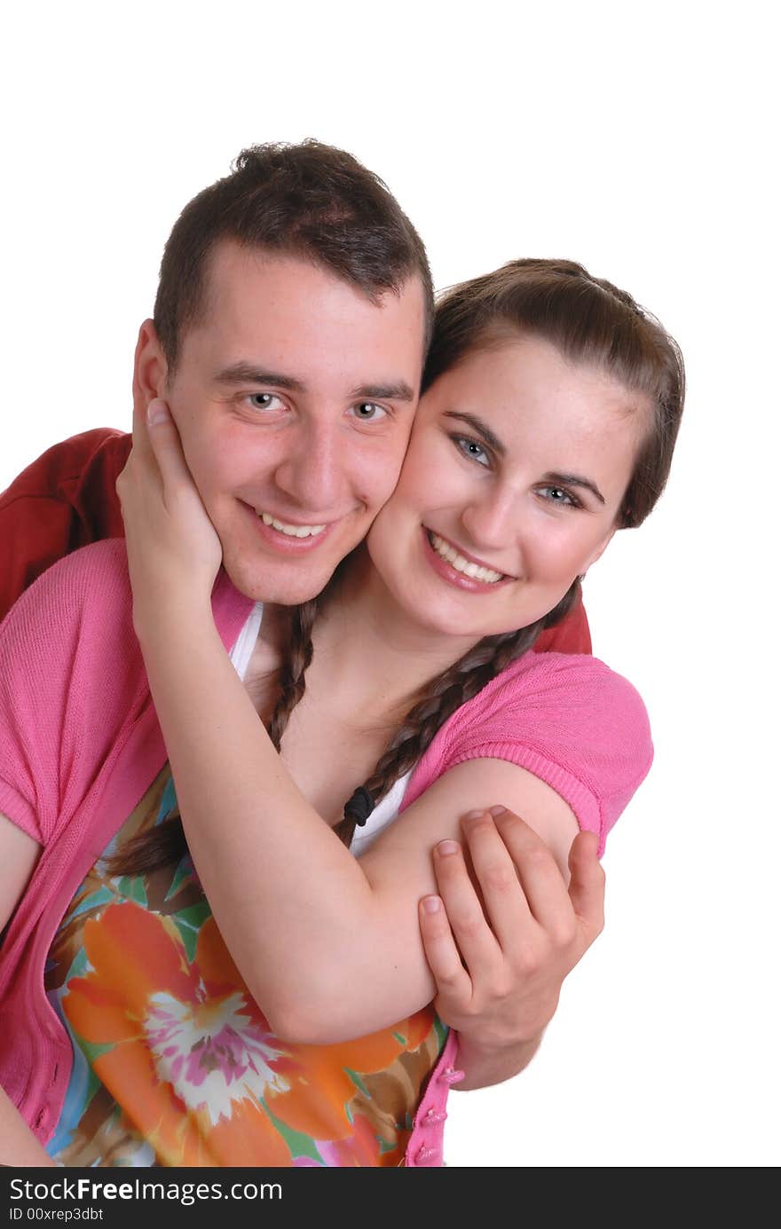 Attractive young couple playfully cuddling - on white. Attractive young couple playfully cuddling - on white