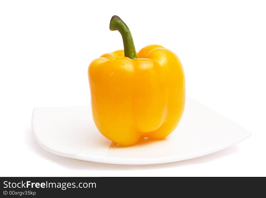 Yellow Paprika On White Ceramic Plate