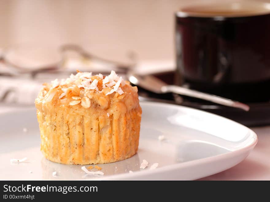 Freshly baked tropical pineapple muffin with coffe and the morning newspaper. Freshly baked tropical pineapple muffin with coffe and the morning newspaper