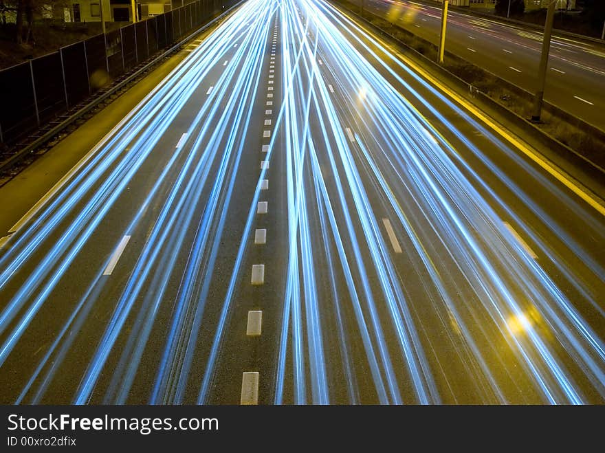 Highway at night with motion of car headlights. Highway at night with motion of car headlights.